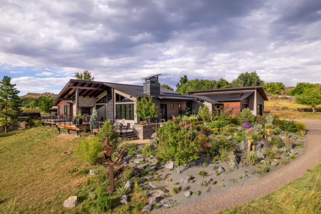 Contemporary custom residential architecture in Colorado. This home focuses on large windows and slanted roofs. In addition, We've integrated sustainable design through gardens and wild space.